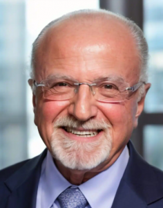 Photo is of Martin Solomon, a lawyer, dressed in a business suit, smiling