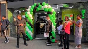 caprinos pizza nottingham city opening day. The manager of Caprinos Pizza, Abed, is in front of the restaurant and welcoming the customers.