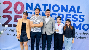 Group photo taken in front of the exhibition backdrop at the National Congress of LDRRMOs, showing Simon John Rodriguez (TWD CEO) and Even Koh (Robotimize Group GM) standing together and smiling.
