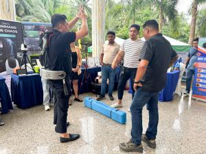 Person demonstrating the ExoVivante™ FIT-HV Pro exoskeleton for disaster response frontliners during a live session at the congress.