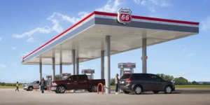 People visiting a Phillips 66 gas station to fill up their gas tanks.