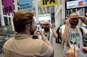 Journalists test smart glasses at IFA 2024 in Berlin.