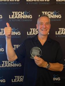 MYdys CEO Frederic Sudraud with the ISTE award