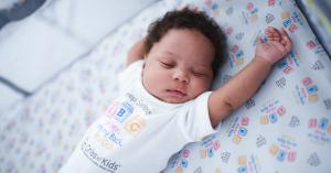 Baby sleeping safely Alone, on their Back, in a Crib.