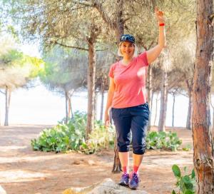 Izabel Coutu outdoors in nature, reflecting the balance and lifestyle freedom she’s gained through her work with Prosperity Of Life.