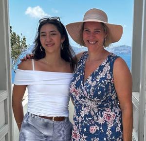 Izabel Coutu smiling with her daughter, highlighting the family time and lifestyle freedom made possible through her work with Prosperity Of Life.