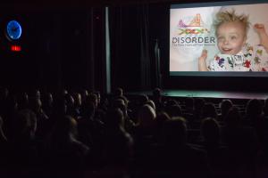 A scene form our 2017 festival a full house crowd watches films at Disorder the Rare Disease Film Festival
