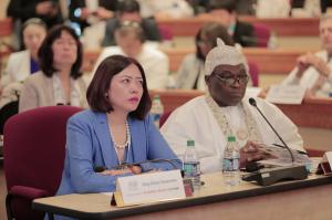 His Royal Majesty King Adedapo Adeen Aderemi (right) and Jing Zhao Cesarone, the Executive Chairperson of the Conference and CEO of Global CSR Foundation (left) listening to the speakers