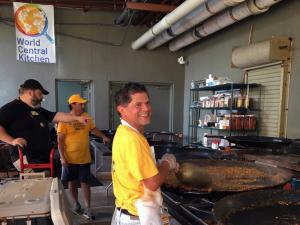 Volunteers help with the cooking.